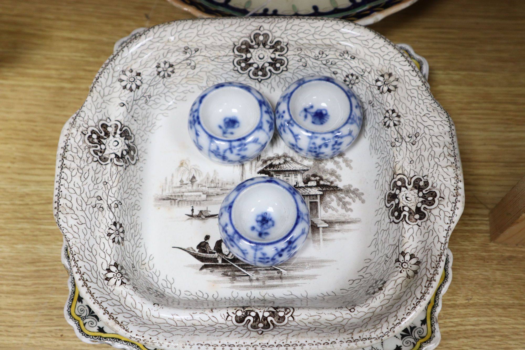 A gilt painted pottery plaque and mixed ceramics